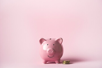 Cute pink piggy bank, close up view.