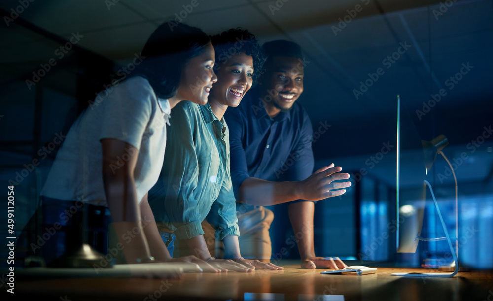 Poster we get what we give our time to. shot of a group of young businesspeople using a computer together d