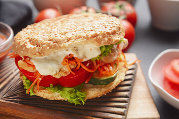 Fresh doner kebab in bun on table, closeup