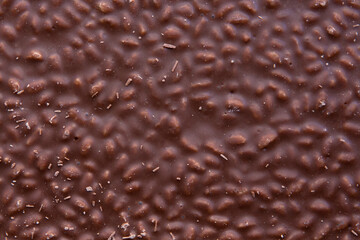 close-up of milk chocolate bar with rice crisps. top view