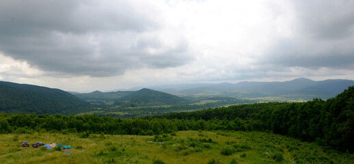 Beautiful landscapes of Ukraine, overcast sky in the Carpathians, outdoor recreation, rest in nature in a tent.