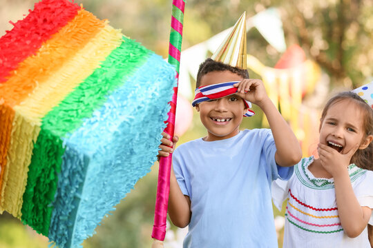 Cute children at pinata birthday party