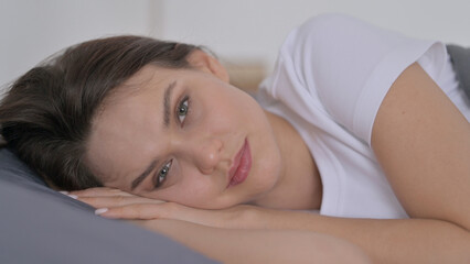 Fototapeta na wymiar Woman Awake in Bed Thinking 