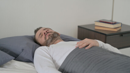Fototapeta premium Man Waking up from Nightmare in Bed