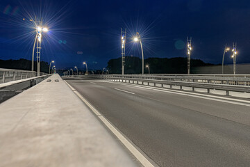 Fototapeta na wymiar nibelung bridge road night car backplate no car