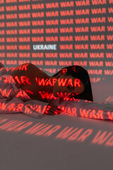 Portrait of a Ukrainian girl under neon red light digital interface background. The projector is illuminated on the face and background. Pray for Ukraine. Ukraine and war.