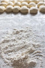 Flour and dough for pies on the kitchen table. Baking at home. Selective focus.
