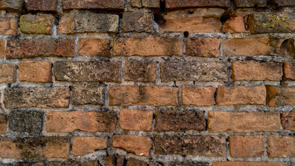 Closeu up of an old light orange brick wall