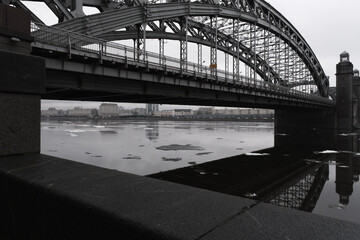 Panorama on a bridge over the river in the city, view from the bottom