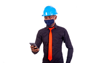 young man engineer using a mobile phone.