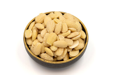 Peeled almond kernel isolated on white background. A bowl of almonds. close up