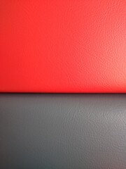 Red and grey leather surface as background