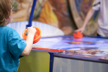 Board game air hockey, family vacation with young children.