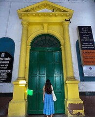 person in front of church door