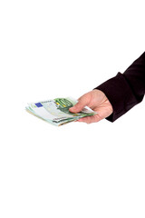 a hand holding out a wad of euros, on a white background close-up