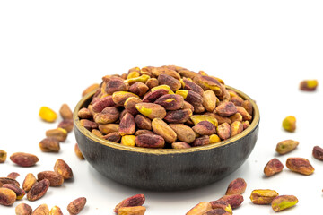 Pistachio kernel isolated on white background. A bowl of pistachios. close up