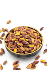 Pistachio kernel isolated on white background. A bowl of pistachios. close up