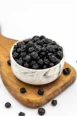 Dried blueberries isolated on a white background. Bulk blueberries. close up