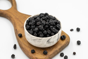 Dried blueberries isolated on a white background. Bulk blueberries. close up