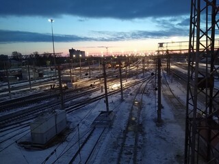 Obraz premium railway station from above at dawn with blue clouds