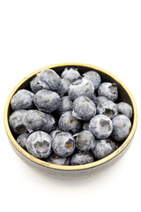 Blueberry isolated on white background. Blueberries in the bowl. Close-up.