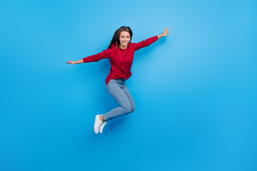 Fototapeta na wymiar Full body photo of nice young lady jump wear eyewear shirt jeans footwear isolated on blue background