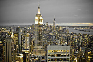 Epic skyline of New York City black and white night view with yellow lights