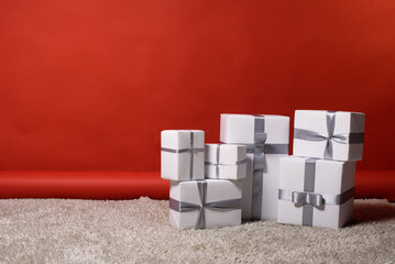 set of gifts bandaging ribbons stand horizontally, offset to the right, free space, postcard