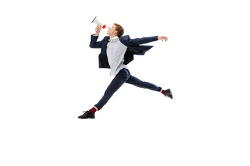Fototapeta na wymiar Man in office style clothes jumping and dancing isolated on white studio background. Business, start-up, open-space, inspiration concept.