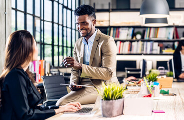 Group of business meeting and discussing strategy with startup project analysis finance process.Success business people plan and brainstorm marketing idea with computer and document in office.Teamwork