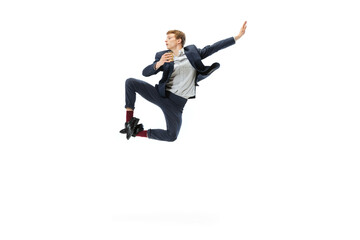 Young man in office style clothes jumping isolated on white studio background. Business, start-up, open-space, inspiration concept.