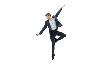 Fototapeta na wymiar Portrait of flexible man in business style clothes dancing isolated on white studio background. Business, start-up, open-space, inspiration concept.