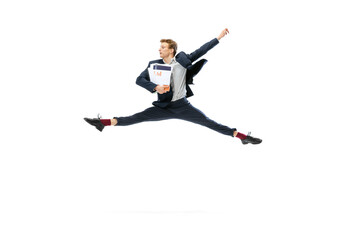 Young man in dark business suit jumping, flying isolated on white background. Art, motion, action, flexibility, inspiration concept.