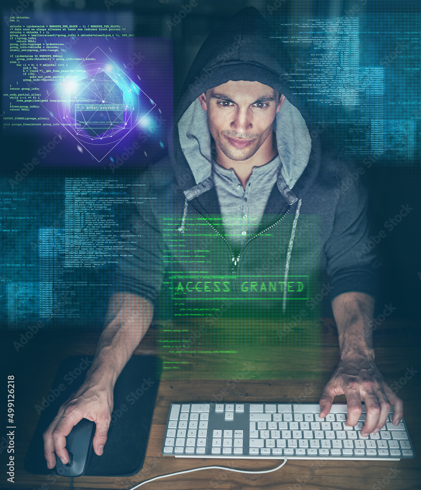 Poster its all falling into place now. shot of a young programmer working on his computer late at night.