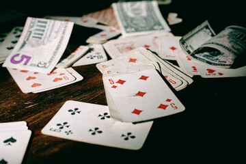 old playing cards for poker on a wooden table