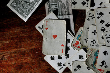 old playing cards for poker on a wooden table