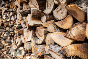 Stack of firewood, alternative energy source. Sustainable fuel.