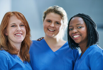 Three times the surgical skill. Portrait of a team of confident young surgeons working in a hospital.