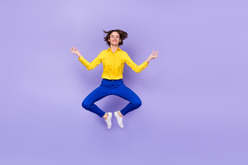 Fototapeta na wymiar Full size photo of rest young brunette lady jump wear shirt pants shoes isolated on purple background