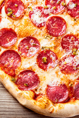 Pepperoni Pizza with Mozzarella cheese, salami, Tomato sauce, pepper, Spices. Italian pizza on...