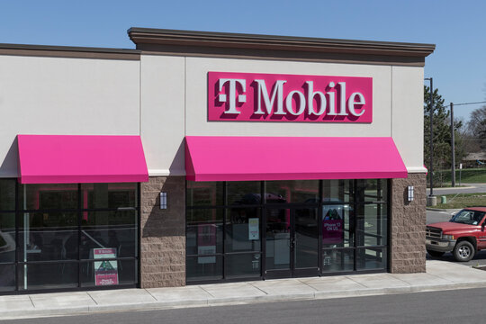 T-Mobile cell and mobile phone store. T-Mobile merged with Sprint to create a larger 5G internet and communications network.