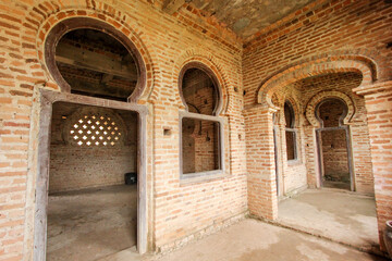 Bare door frames and masonry of brick walls inside the unfinished monument of Kellie's Castle in Batu Gajah.