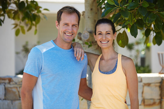 Ive Found A Fitness Partner For Life. Portrait Of A Happy Couple Jogging Together In Their Neighborhood.