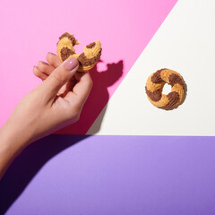 conceptual photography, hands reaching for the cookies. top view