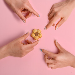conceptual photography, hands reaching for the cookies. top view