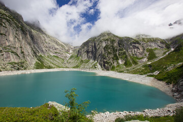 picturesque blue Gelmersee in the swiss mountains
