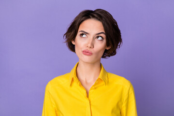 Fototapeta premium Photo of hr young bob hairdo lady look up wear yellow blouse isolated on violet color background