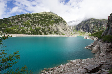 Fototapeta na wymiar Picturesque blue Gelmersee in the Bernese Oberland