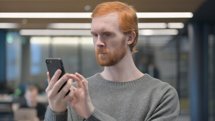 Portrait of Young Man using Smartphone