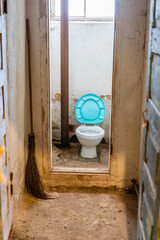 Old dirty toilet in abandoned warehouse